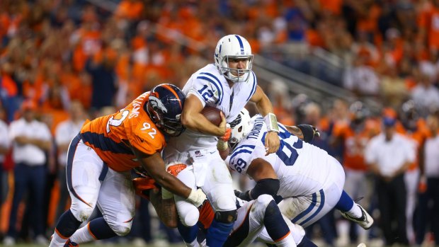 In action: Sylvester Williams grabs Indianapolis quarterback Andrew Luck during a regular season game.
