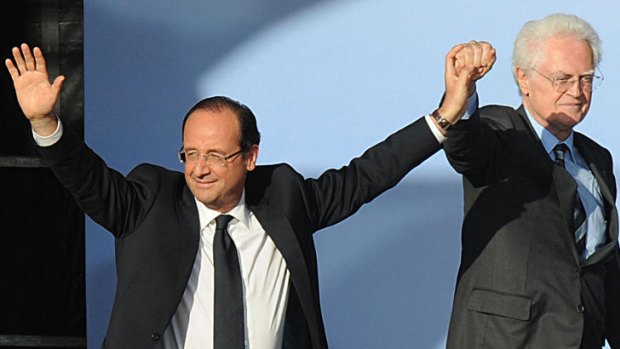 Sensing victory ... Francois Hollande, left, flanked by French former Prime Minister Lionel Jospin.