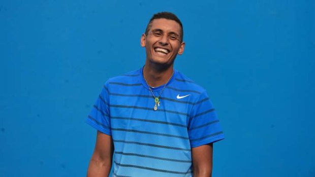 Nick Kyrgios enjoys a lighter moment during Wednesday's warm-up.