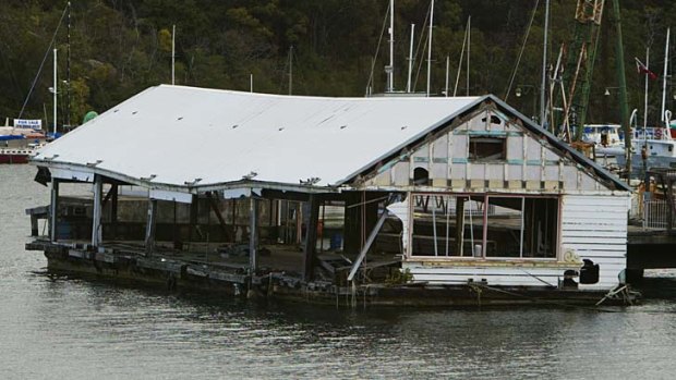 Vision versus reality: The old barge at Berrys Bay in 2000, was once used as a floating dance hall.
