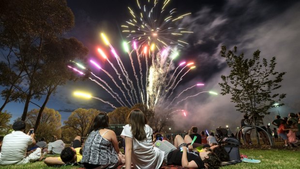 Families watch the fireworks during the Family New Year's celebration in Melbourne.