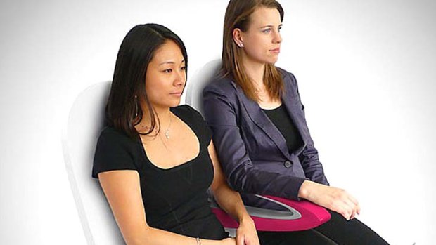 Paperclip armrest can reduce 'elbow room' spats.