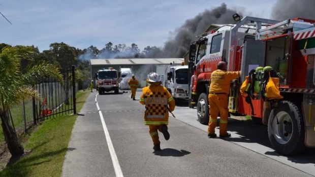 Firefighters rush to the out of control fire at South Nowra, in the Shoalhaven.