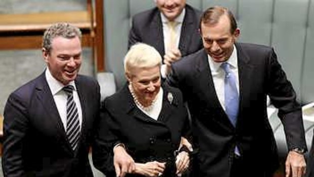 Not quite a struggle: Bronwyn Bishop is led to the Speaker's chair.