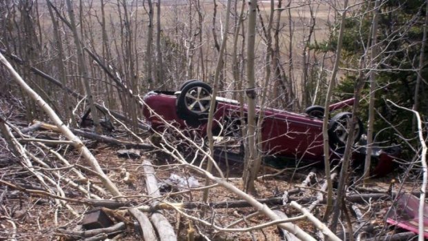 Kristin Hopkins' car is seen after she drove off the roadway in Colorado.