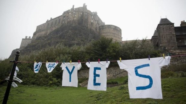 A Yes campaign washing line for the Scottish independence referendum stands backdropped by Edinburgh Castle, in Edinburgh, Scotland.
