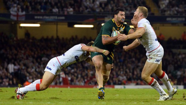 Australia's Andrew Fifita breaks through the England defence during the 2013 Rugby League World Cup group A match between Australia and England at the Millennium Stadium in Cardiff.