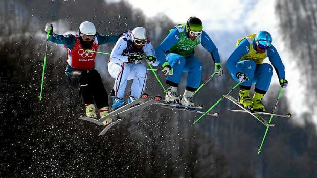 Ups and downs: Anton Grimus of Australia (left) competes in the Freestyle Skiing Men's Ski Cross Finals.