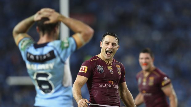 Jubilant:  Cooper Cronk of the Maroons celebrates victory after game one. 