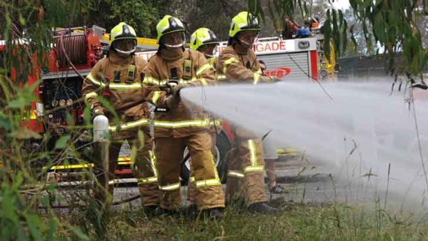 On the job: Firefighters practise at Warrandyte yesterday.