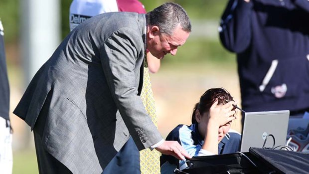 Stats check &#8230; biochemist Stephen Dank studies the figures during a Manly Sea Eagles training session at Narrabeen in 2010. He says everything he did while at Manly was above board.
