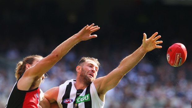 Falling short: Travis Cloke can't grasp the ball in a contest with St Kilda's Josh Bruce.