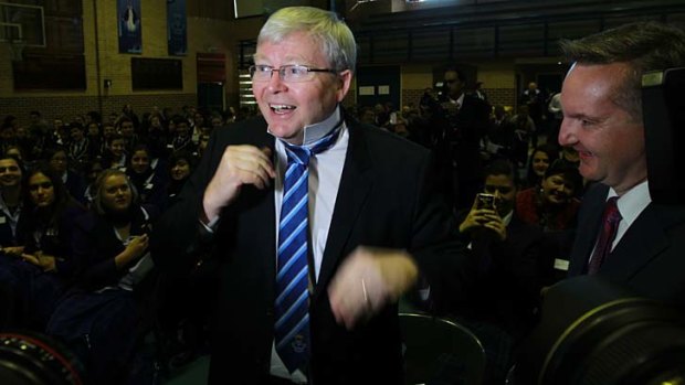A gift: Kevin Rudd tries on a blue tie given to him at Patrician Brothers' College in Fairfield.