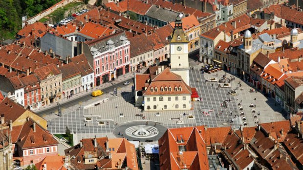 Off the trail: Brasov, with its white church and belfry in the town square.