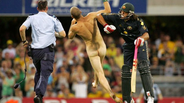 Andrew Symonds tackles a streaker  at the Gabba in 2008.