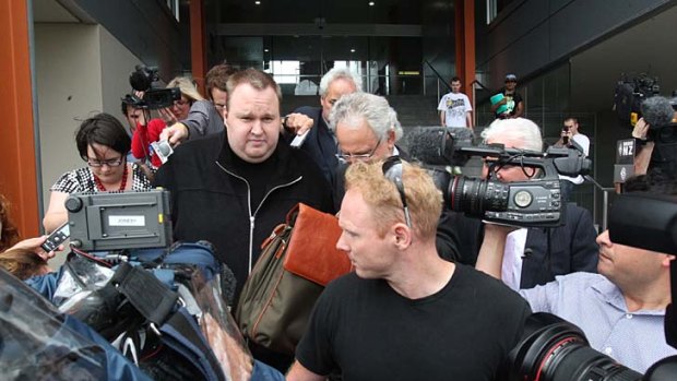 Kim Dotcom leaves North Shore District Court in Auckland.