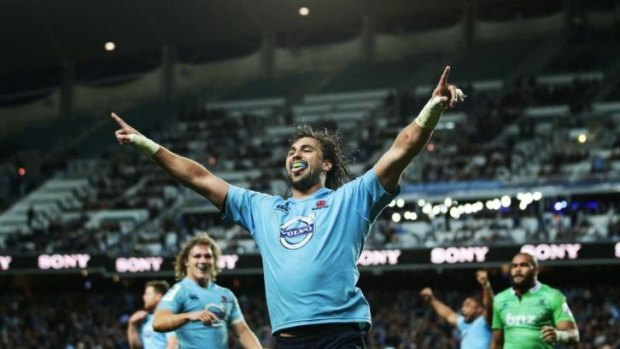 Staying with the Tahs ... Jacques Potgieter celebrates scoring a try against the Highlanders.