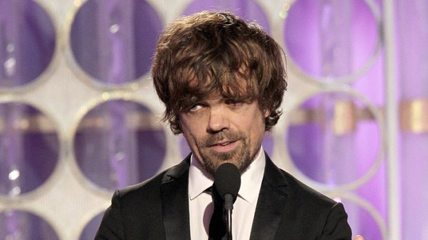 'Google him' ... Peter Dinklage accepts the Golden Globe for Best Supporting Actor yesterday.