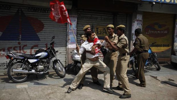 Disrupting trains, closing schools and shutting up shop ... angry demonstrators pull off a national strike protesting a government decision to cut fuel subsidies and open India's huge retail market to foreign companies.