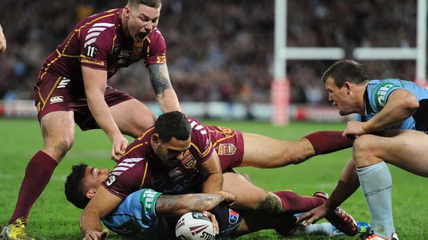 Get square: Greg Inglis played a key role for the Maroons.