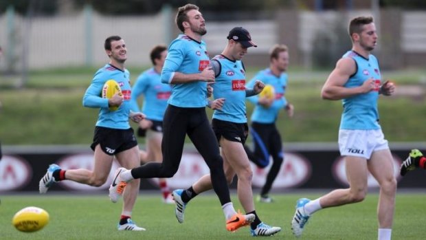 On the rise: Essendon players at training.