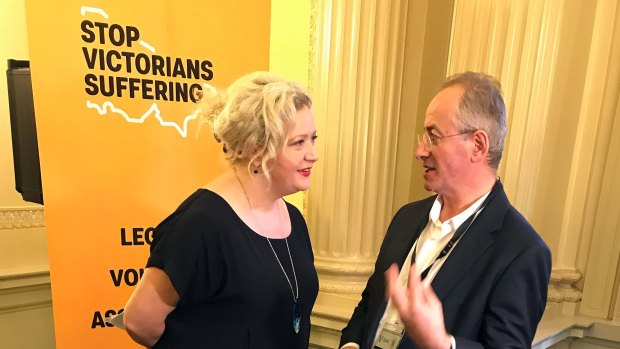 Euthanasia advocate Andrew Denton (right) speaks with Victorian Health Minister Jill Hennessy at Victorian Parliament. 