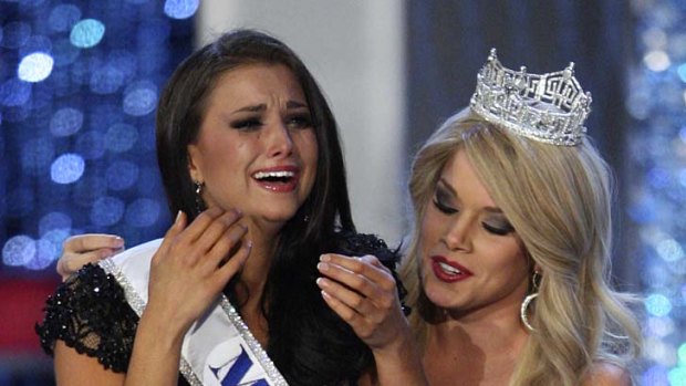 Tears of joy ... Laura Kaeppeler is crowned the winner by Miss America 2011 Teresa Scanlan.