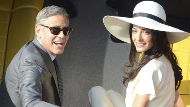 George Clooney and his wife Amal Alamuddin leave the city hall after their civil marriage ceremony in Venice, Italy.