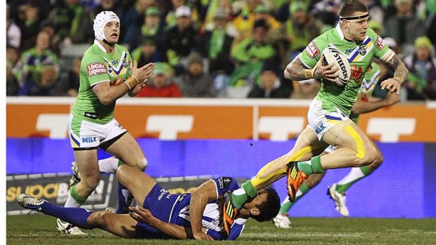 Flattened ... Josh Dugan forces his way through the Bulldogs' defence.
