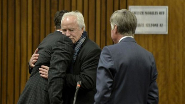 Oscar Pistorius gets a hug from his father Henke ahead of closing arguments at his murder trial in Pretoria.