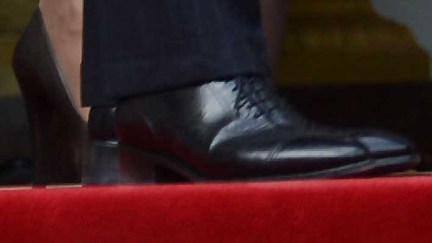 Putting le boot in ... Sarkozy's heel.