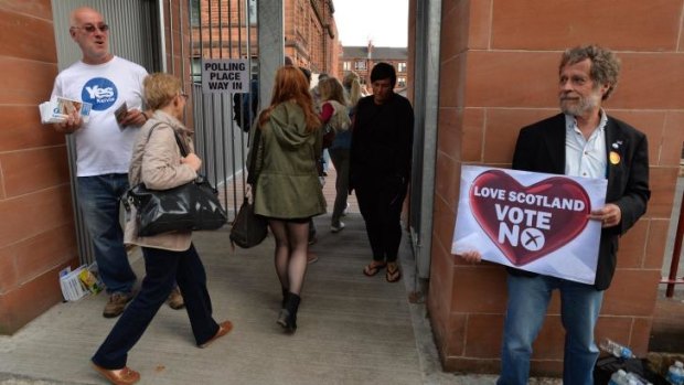 Voters come to Notre Dame Primary School polling station as the people of Scotland take to the poles to decide their country's fate in a historic vote in Glasgow, Scotland.