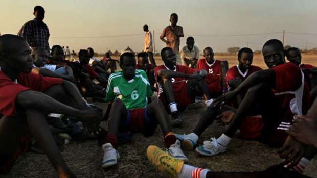 Players relax after the local derby. The restive area is disputed by the separate regimes in the north and south of Sudan.