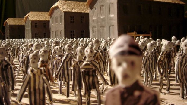 Thousands of three-inch-high puppets represent prisoners in the Auschwitz-Birkenau concentration camp in <i>Kamp</i> by Hotel Modern.