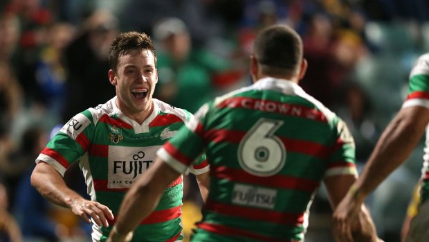 Here come the Bunnies: Luke Keary celebrates with Greg Inglis after scoring a try on Friday night. 