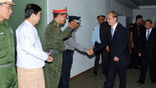 Historic visit: Myanmar's President Thein Sein shakes hands with cabinet ministers as he leaves for a state visit to the US - the first in 47 years.