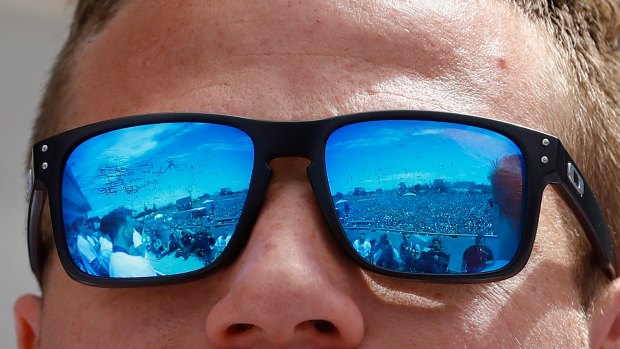 The huge crowd in the reflection of Jake Stringer's sunglasses during the Whitten Oval family day celebrations. 