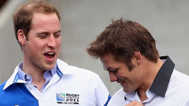 Prince William and Richie McCaw share a joke.