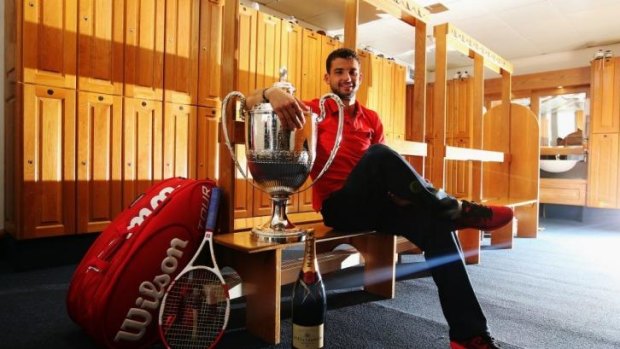 Grigor Dimitrov of Bulgaria with the spoils of victory.