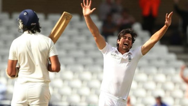 England captain Alastair Cook celebrates after taking the wicket of India's Ishant Sharma .