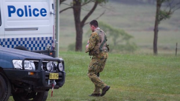 A policeman was wounded as officers approached a campsite.