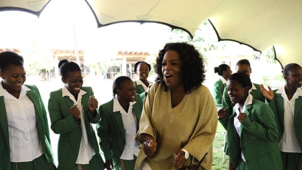 Celebrating ... Oprah Winfrey at the South African school.