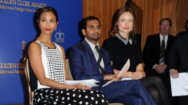 Actors, from left, Zoe Saldana, Aziz Ansari and Olivia Wilde attend the 71th Annual Golden Globes Awards nominations event at the Beverly Hilton Hotel.