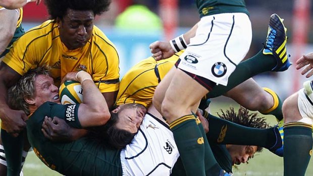 Hair-raising ... Radike Samo, who is doubtful for this weekend, and Adam Ashley-Cooper, who is out, hit Jean de Villiers hard.
