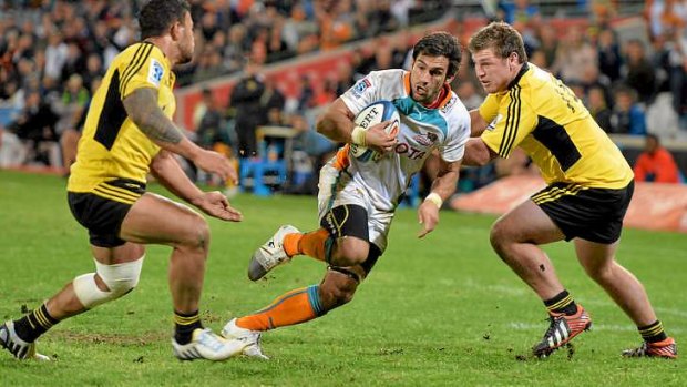 Robert Ebersohn of the Cheetahs eyes an opening in the Hurricanes defence.