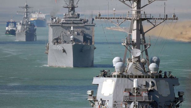 US Navy ships transiting through the Suez Canal. US Defence Secretary Chuck Hagel strongly suggested the Pentagon was moving forces into place ahead of possible military action against Syria.