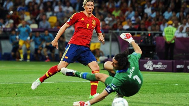 Nimble ... Spain's Fernando Torres scores in the Euro 2012 final.