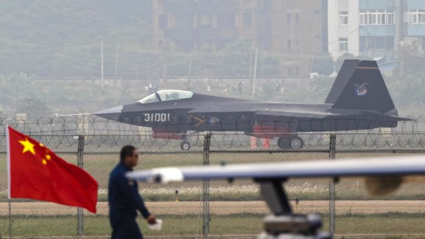 A J-31 stealth fighter of the Chinese People's Liberation Army Air Force lands on a runway after a flying performance at the 10th China International Aviation and Aerospace Exhibition in Zhuhai, Guangdong.