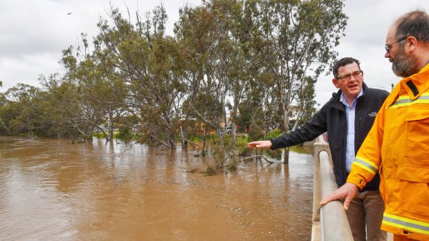 Premier Daniel Andrews and SES David Pollard inspect flooding at Charlton.