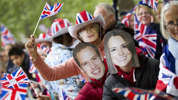 Famous faces ... well-wishers line the procession route in London.
